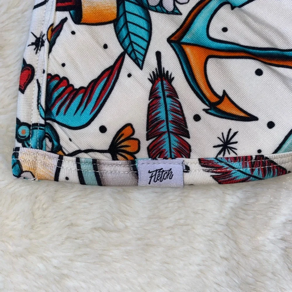 New Tough Love Teal Fletch bib